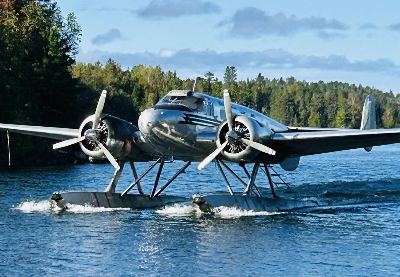 A float plane taxiing on Rowan Lake